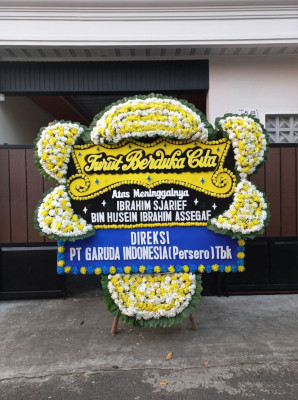 Papan Bunga Duka di Harapan