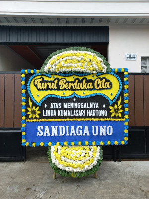 Papan Bunga Duka di Harapan